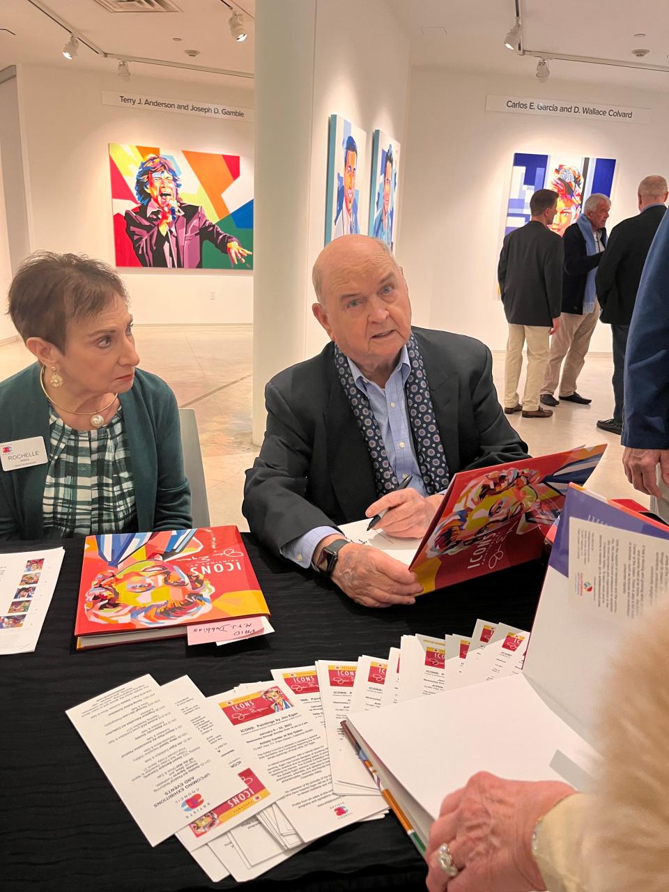 Jim Egan signs a copy of the book about his exhibition,  Icons: Paintings by Jim Egan, at the Artists Center at the Galen in Palm Desert on Saturday, Jan. 7, 2023. The show runs through Jan. 22