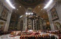 Pope Francis leads the Christmas night Mass in Saint Peter's Basilica at the Vatican December 24, 2016. REUTERS/Tony Gentile