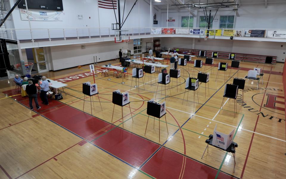 The voting booths were empty at the Hyannis Youth & Community Center Tuesday morning. Election workers said the ballots were locked in a vault at Barnstable Town Hall and the vault couldn't be opened. To see more photos, go to www.capecodtimes.com/news/photo-galleries.