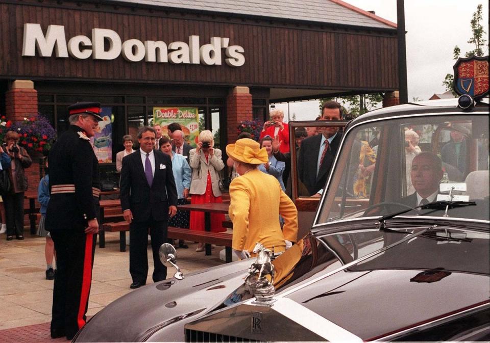 The Queen arrives at a McDonald’s restaurant in Cheshire in 1998 (PA) (PA Archive)
