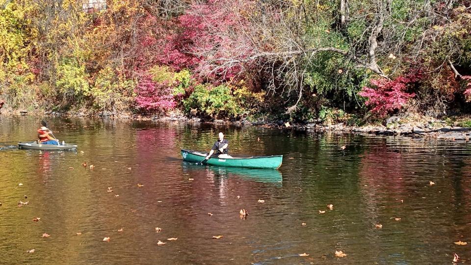 Canoeists paddle in the Lackawaxen River at White Mills on Oct. 27, 2023, celebrating the dedication that day of the new Pennsylvania Fish & Boat Commission river access at that point. From left are Connor Simon of the Wayne County Community Foundation and Dan Corrigan of Northeast Wilderness Experience.