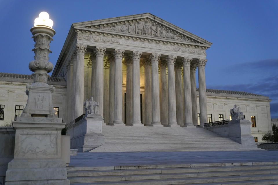 FILE - Light illuminates part of the Supreme Court building at dusk on Capitol Hill in Washington, Nov. 16, 2022. In courtrooms across America, defendants get additional prison time for crimes that juries found they didn’t commit. The Supreme Court is being asked, again, to put an end to the practice.(AP Photo/Patrick Semansky, File)