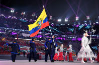 <p>Flag bearer of Ecuador Klaus Jungbluth Rodriguez and teammates enter the stadium during the Opening Ceremony of the PyeongChang 2018 Winter Olympic Games at PyeongChang Olympic Stadium on February 9, 2018 in Pyeongchang-gun, South Korea. (Photo by Matthias Hangst/Getty Images) </p>