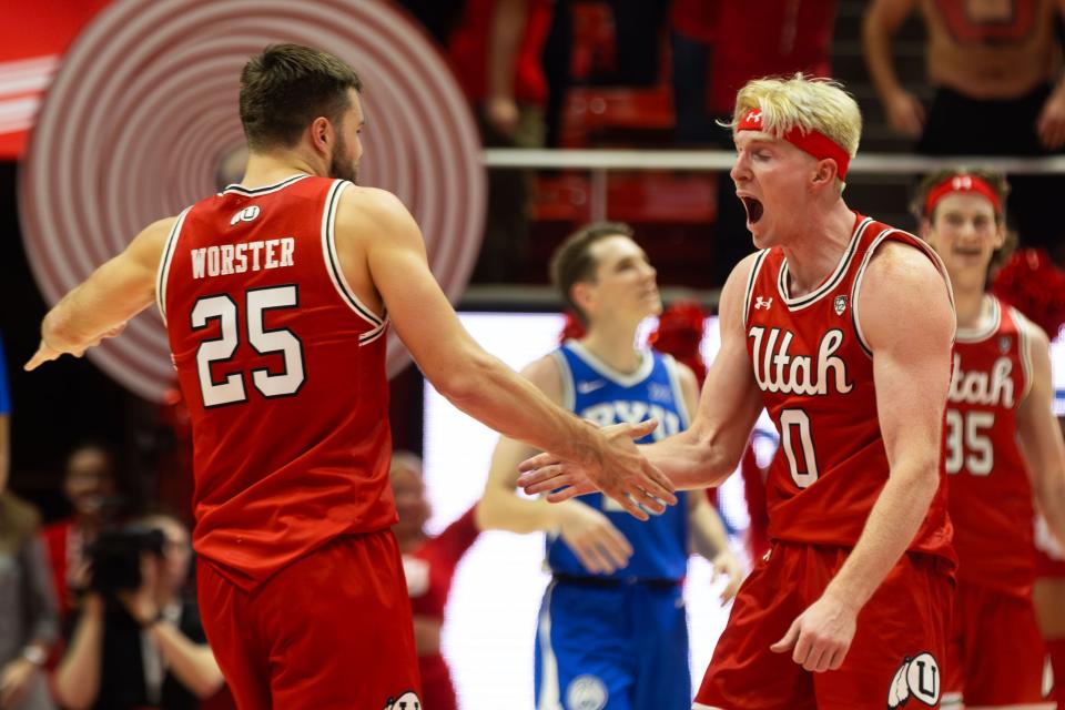 Utah Utes guards Rollie Worster (25) and Hunter Erickson (0) celebrate during a men’s basketball game against the Brigham Young Cougars at the Jon M. Huntsman Center in Salt Lake City on Saturday, Dec. 9, 2023. | Megan Nielsen, Deseret News