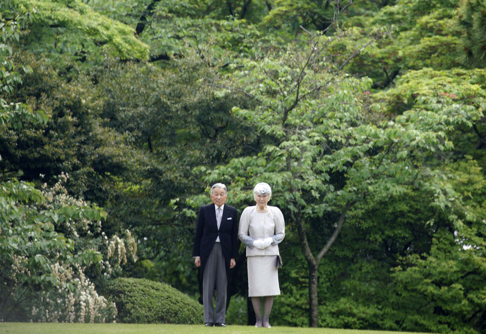 FILE - In this April 25, 2018, file photo, Japan's Emperor Akihito and Empress Michiko attend a spring garden party at the Akasaka Palace imperial garden in Tokyo. Akihito has devoted his 30-year reign to making amends for a war fought in his father’s name, while adapting the 1,500-year-old monarchy to draw the Imperial Family closer to the public. (AP Photo/Eugene Hoshiko, File)