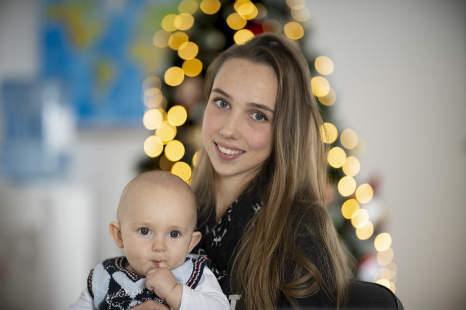 Vlada Yushchenko, a 19-year-old Ukrainian refugee, holds her son Daniel, during an interview with The Associated Press in Brasov, Romania, Thursday, Feb. 2, 2023. Yushchenko was still in her teens and nearly three months pregnant when she hugged her husband at the border, turned away and walked into Moldova. Now she’s in Romania, one of the millions of Ukrainians forced to flee Russia’s invasion of their country. Her baby, Daniel, was born there eight months ago and still hasn’t met his father Yaroslav, who is 21 and, like most men of fighting age, prohibited from leaving Ukraine. (AP Photo/Vadim Ghirda)