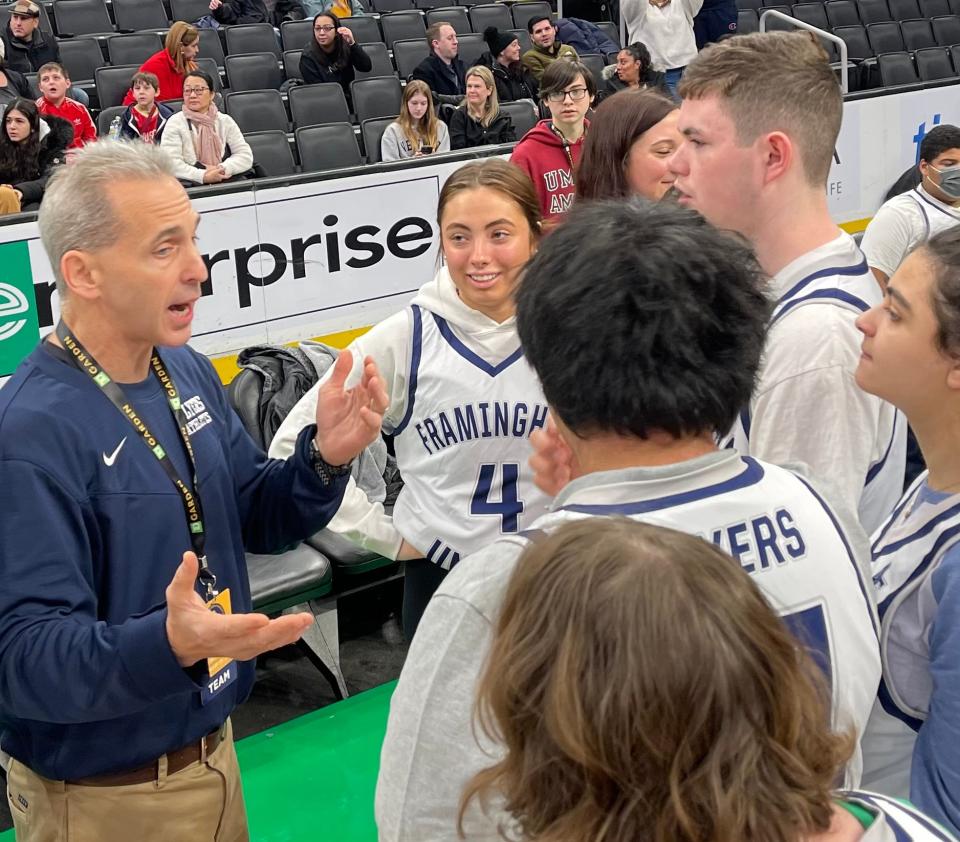 Framingham Unified coach Mike Tarlin talks to his team on Saturday morning during the Andrew Lawson Invitational at TD Garden.