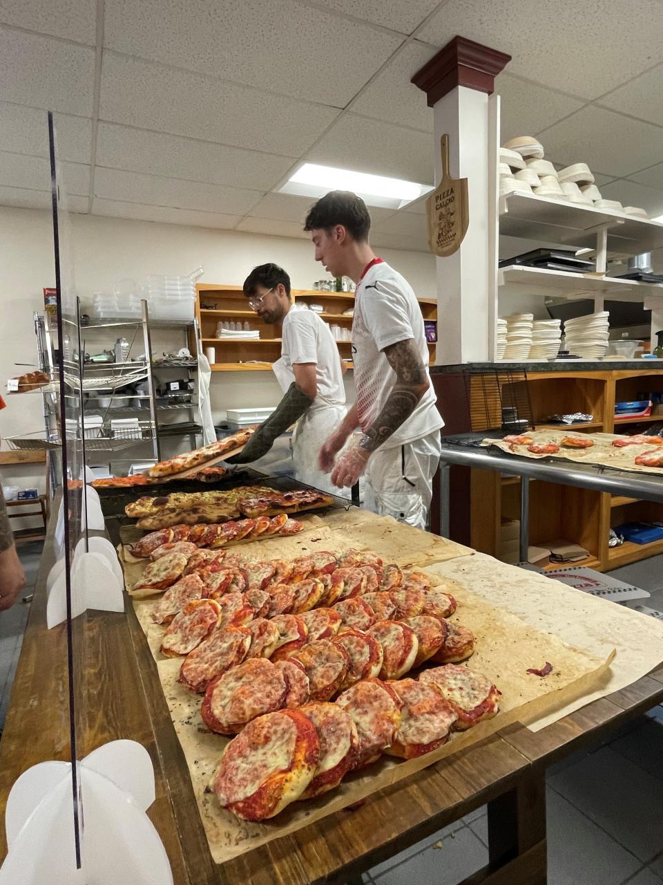 Brothers Billy (left) and Ryan Gushue work at Forno Tony on a busy Saturday in November 2022.