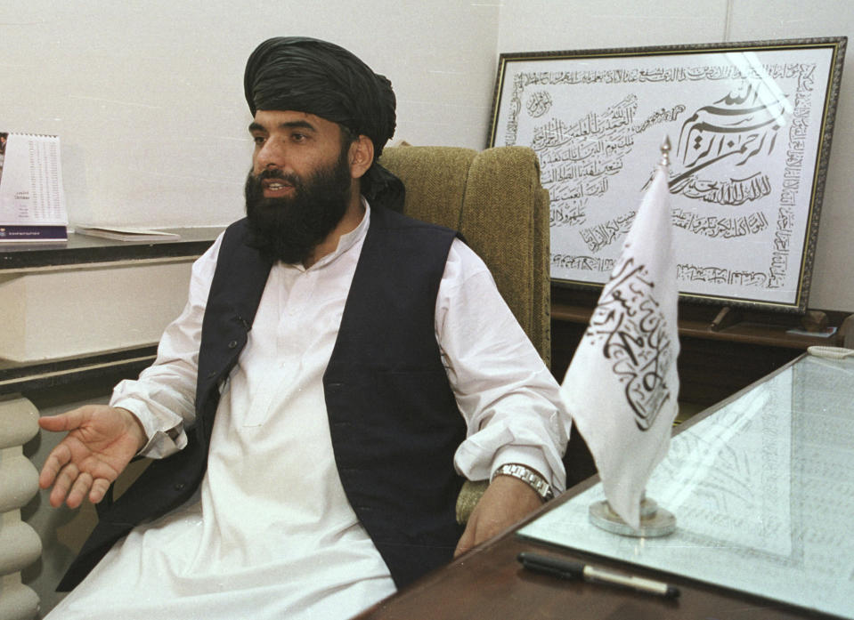 FILE - In this Nov. 14, 2001 file photo, Suhail Shaheen, then Deputy ambassador of the Islamic Republic of Afghanistan, gives an interview in Islamabad, Pakistan. The Taliban say the gap is narrowing in talks with Washington's special peace envoy over a timetable for the withdrawal of U.S. troops from Afghanistan. The two sides are continuing to meet in Qatar, where the insurgent movement maintains a political office. In a voice message sent Saturday, May 4, 2019, to The Associated Press, the Taliban spokesman in Doha says both sides have offered new proposals for drawing down U.S. and NATO forces. (AP Photo/Tariq Aziz, File)
