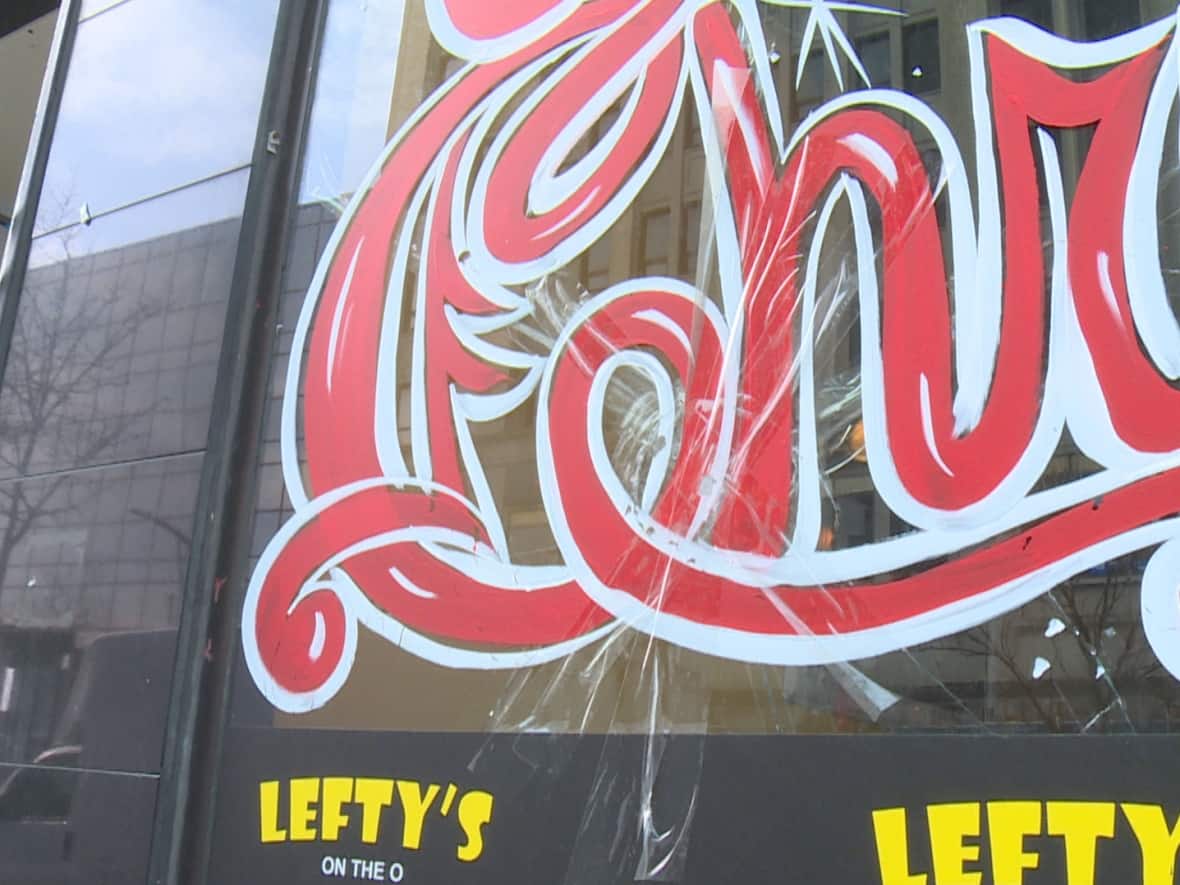 The owner of Lefty's on the O told CBC last month that his window was broken by someone throwing lug nuts. Now, police say a man has been arrested after multiple incidents of a similar nature. (Michael Evans/CBC - image credit)