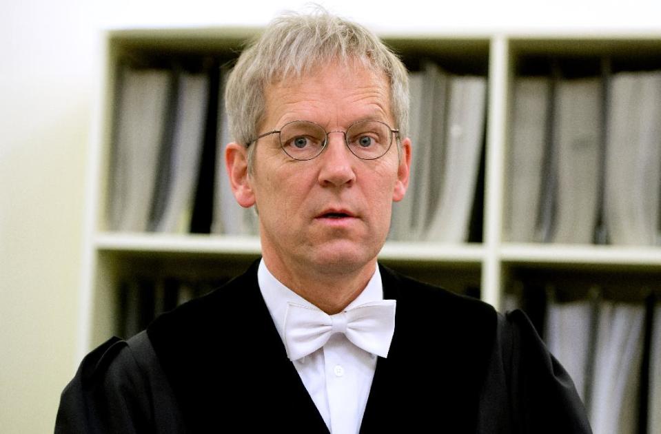 Judge Peter Noll waits for the beginning of the trial against Formula One boss Bernie Ecclestone in the regional court in in Munich, Germany, Thursday, April 24, 2014. Ecclestone is charged with bribery and incitement to breach of trust "in an especially grave case" over a US$ 44 million payment to a German banker, that prosecutors allege was meant to facilitate the sale of the Formula One Group to a buyer of Ecclestone's liking. (AP Photo/Sven Hoppe, pool)