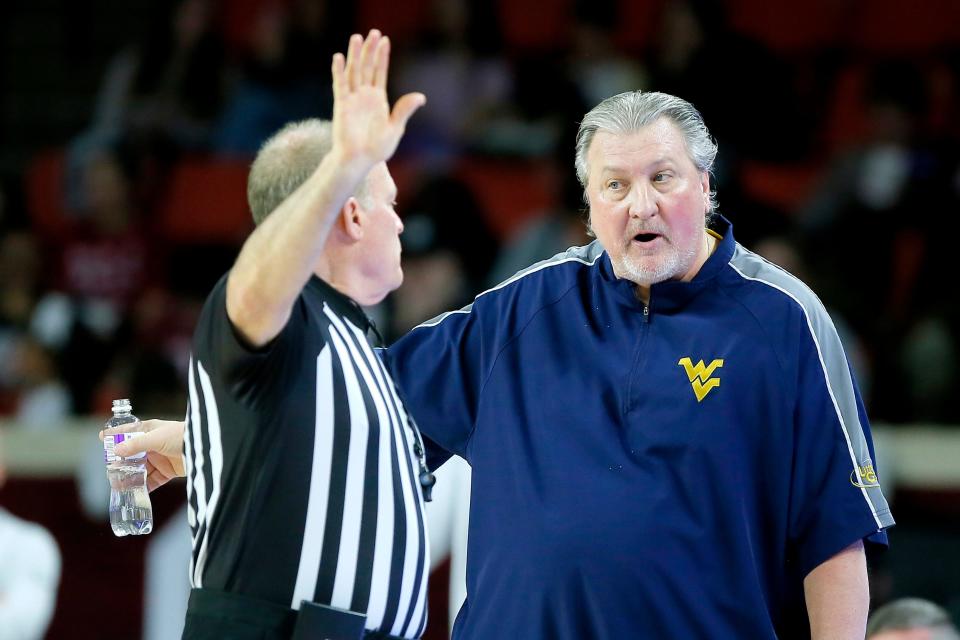 West Virginia coach Bob Huggins talks with an official during a men's Big 12 basketball game between the University of Oklahoma Sooners (OU) and the West Virginia Mountaineers at Lloyd Noble Center in Norman, Okla., Tuesday, March 1, 2022. Oklahoma won 72-59. 