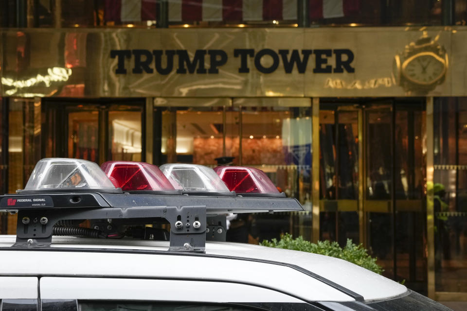 An NYPD patrol car is parked outside of Trump Tower on Thursday, March 23, 2023, in New York. (AP Photo/Bryan Woolston)