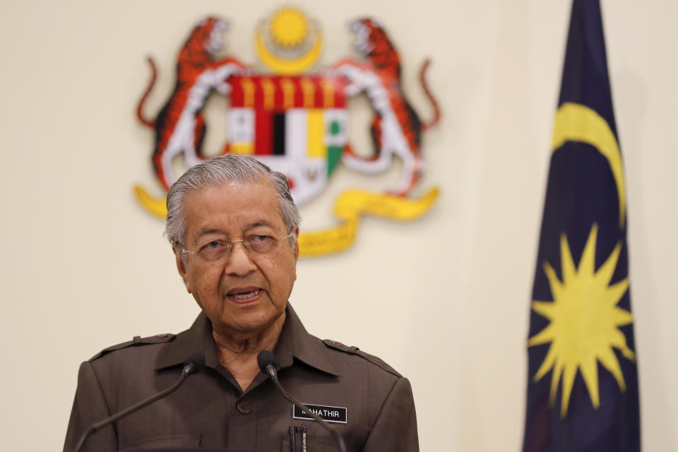 Malaysian Prime Minister Mahathir Mohamad speaks during a press conference in Putrajaya, Malaysia, Monday, April 15, 2019. Malaysia's government decided to resume a China-backed rail link project, after the Chinese contractor agreed to cut the construction cost by one-third. (AP Photo/Vincent Thian)