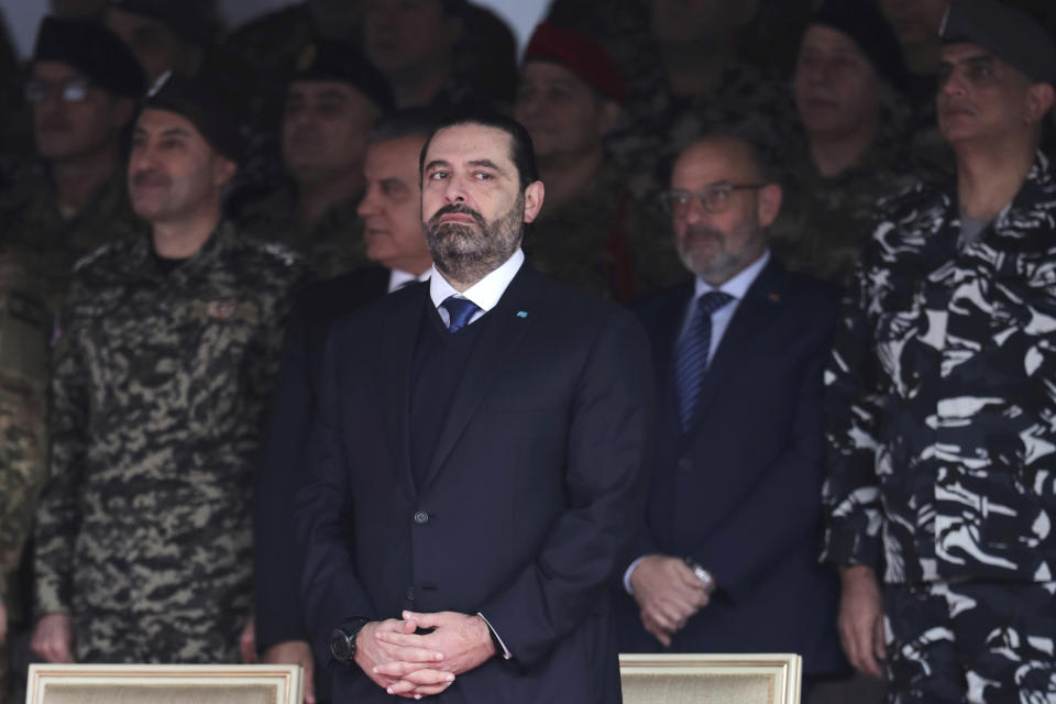 Former Prime Minister Saad Hariri attends a military parade to mark the 76th anniversary of Lebanon's independence from France at the Lebanese Defense Ministry, in Yarzeh near Beirut, Lebanon, Friday, Nov. 22, 2019. Lebanon's top politicians Friday attended a military parade on the country's 76th Independence Day, appearing for the first time since the government resigned amid nationwide protests now in their second month. (AP Photo/Hassan Ammar)