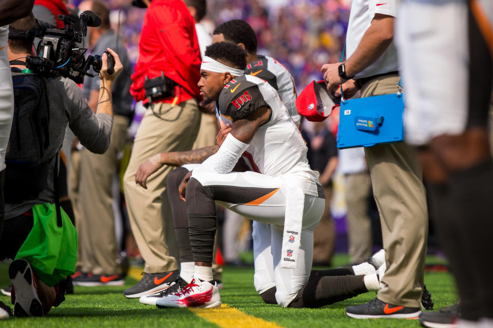 <p>Tampa Bay Buccaneers wide receiver DeSean Jackson (11) and wide receiver Mike Evans (13) kneel for the national anthem before the game against the Minnesota Vikings at U.S. Bank Stadium. Mandatory Credit: Brad Rempel-USA TODAY Sports </p>