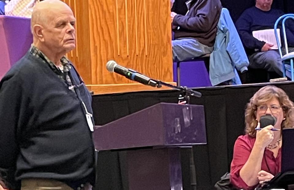 George Seaver of Cataumet spoke against lifting a ban on cannabis sales in Bourne at a special town meeting Monday. He said the zoning district for the sales was too close to schools.