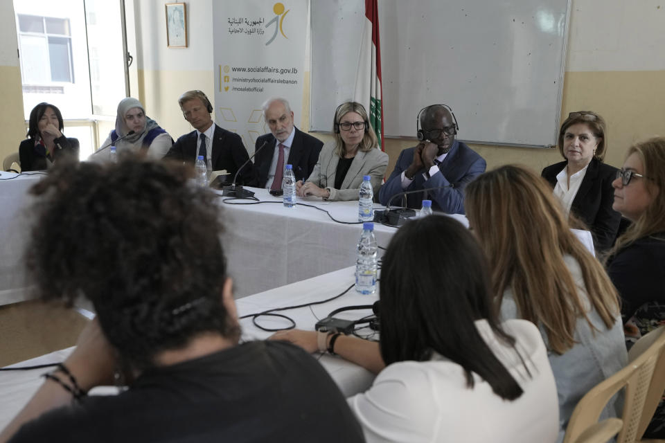 World Bank Managing Director of Operations Anna Bjerde, center, and Middle East and and North Africa region Vice President Ousmane Dione, center right, visit a social development center, in the northern Beirut suburb of Burj Hammoud, Lebanon, Wednesday, May 8, 2024. The program provides aid to about 100,000 vulnerable families in the country, which has been struggling with a severe economic crisis since 2019. (AP Photo/Bilal Hussein)