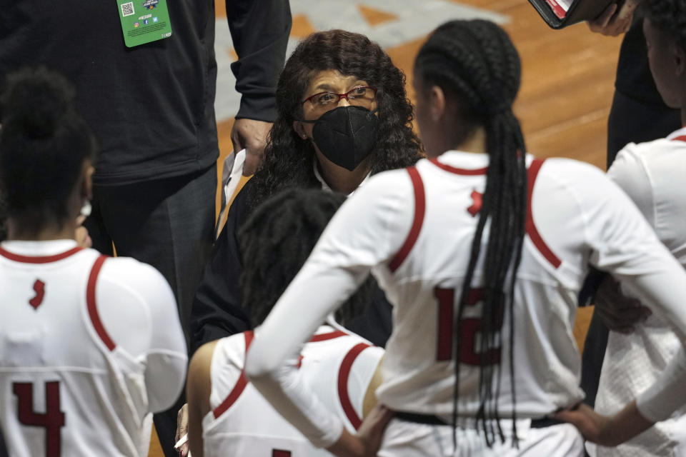Rutgers head coach C. Vivian Stringer talks to her team during a timeout in the first half of a college basketball game against BYU in the first round of the women's NCAA tournament at the University Events Center in San Marcos, Texas, Monday, March 22, 2021. (AP Photo/Chuck Burton)