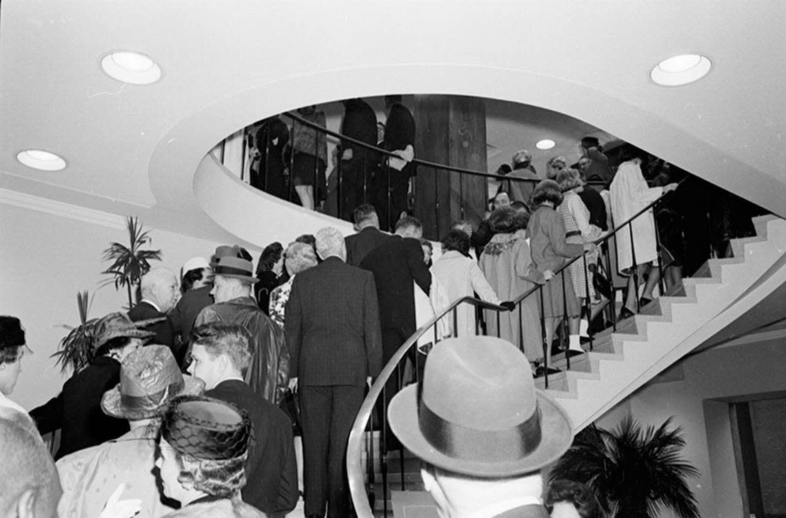 People climb the lobby stairway at the Hotel Texas in downtown Fort Worth to attend the Chamber of Commerce breakfast for President John F. Kennedy and his party. 11/22/1963