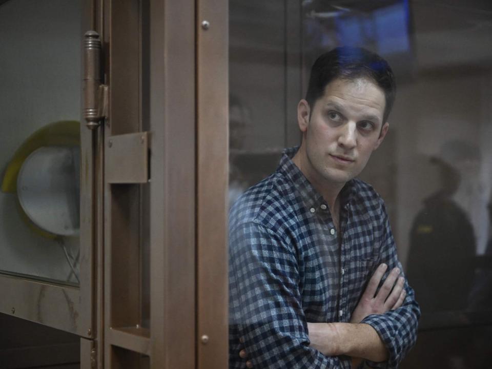 US journalist Evan Gershkovich, arrested on espionage charges, stands inside a defendants' cage at the Moscow City Court in Moscow