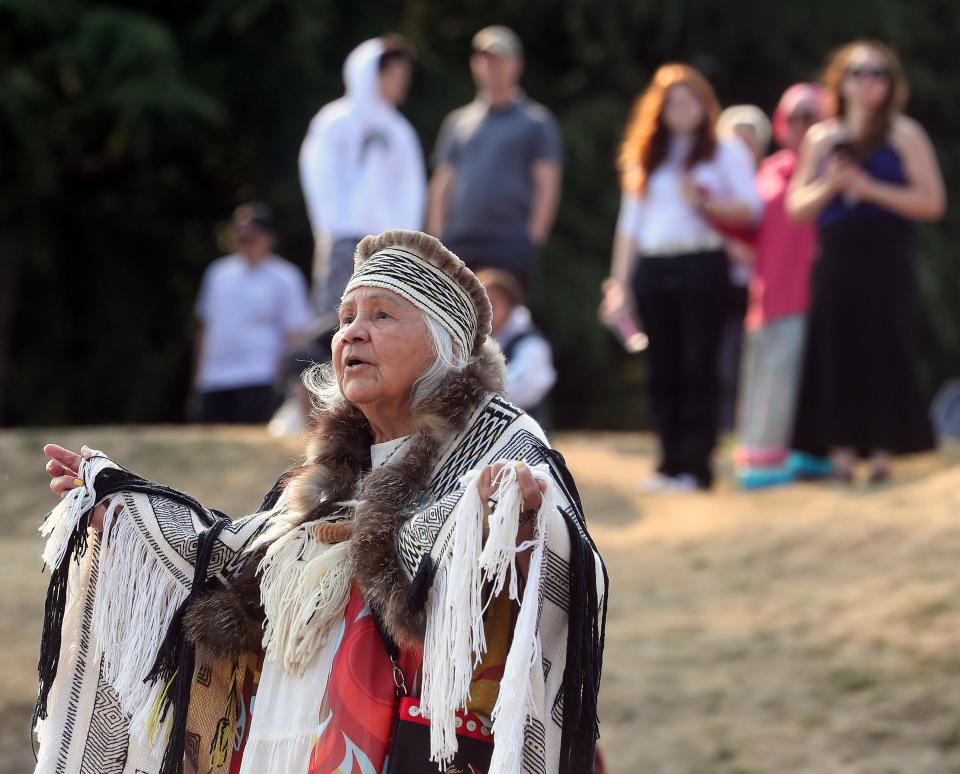 Suquamish elder Darlene Anderson-Peters participates in the welcome song and dance as the traditional Polynesian Voyaging Canoe Hōkūleʻa arrives to the shore of Suquamish on Aug. 24.