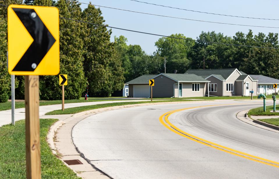 A curve in Riverside Drive where multiple vehicles in the last seven years have jumped the curb and crashed into Cornelius Vannieuwenhoven's house in Suamico, Wis. pictured on Friday, August 18, 2023.