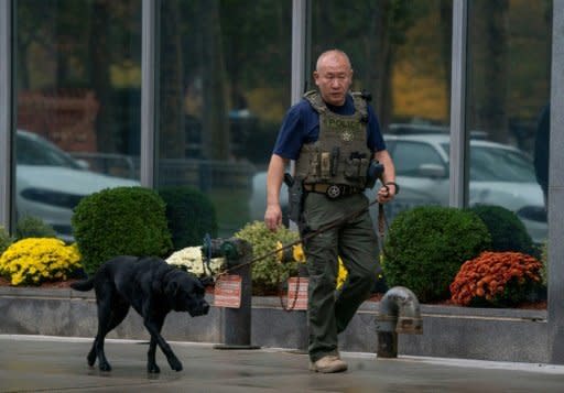 A member of the U.S. Marshals Service patrols outside the courthouse where jury selection for Joaquin "El Chapo" Guzman's trial is taking place. (Photo: Agence France-Presse)