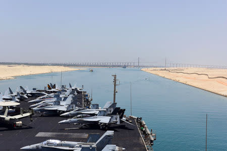 The US Navy aircraft carrier USS Harry S. Truman transits the Suez Canal, Egypt towards the Mediterranean Sea in a photo released by the US Navy June 2, 2016. U.S. Navy/Mass Communication Specialist 3rd Class Anthony Flynn/Handout via REUTERS