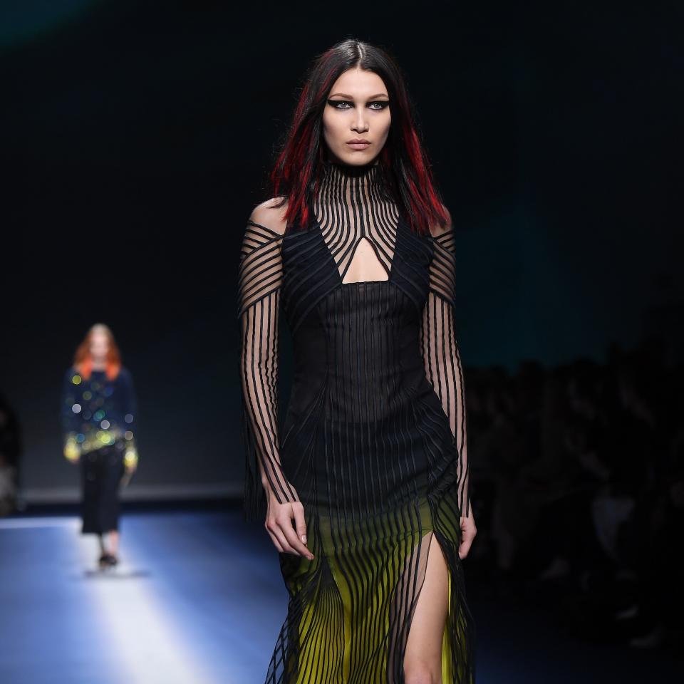 For the Versace fall 2017 show, Bella Hadid's hair had red extensions glued in and we think she looks amazing.