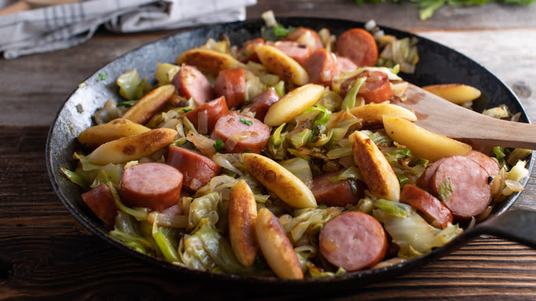 sliced smoked sausages and cabbage