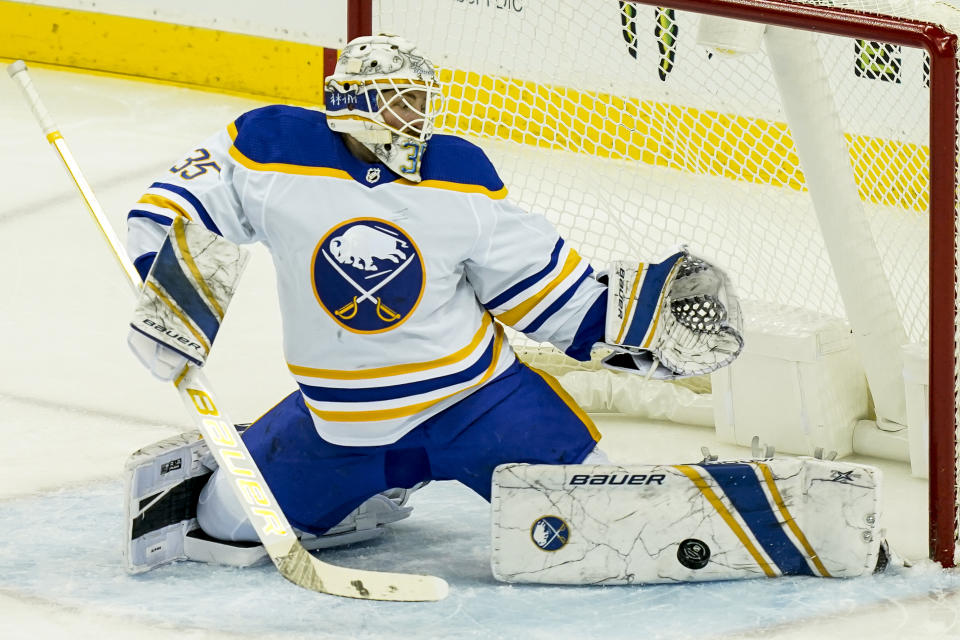 Buffalo Sabres goaltender Linus Ullmark (35) makes a save during the second period of an NHL hockey game against the New Jersey Devils, Saturday, Feb. 20, 2021, in Newark, N.J. (AP Photo/John Minchillo)