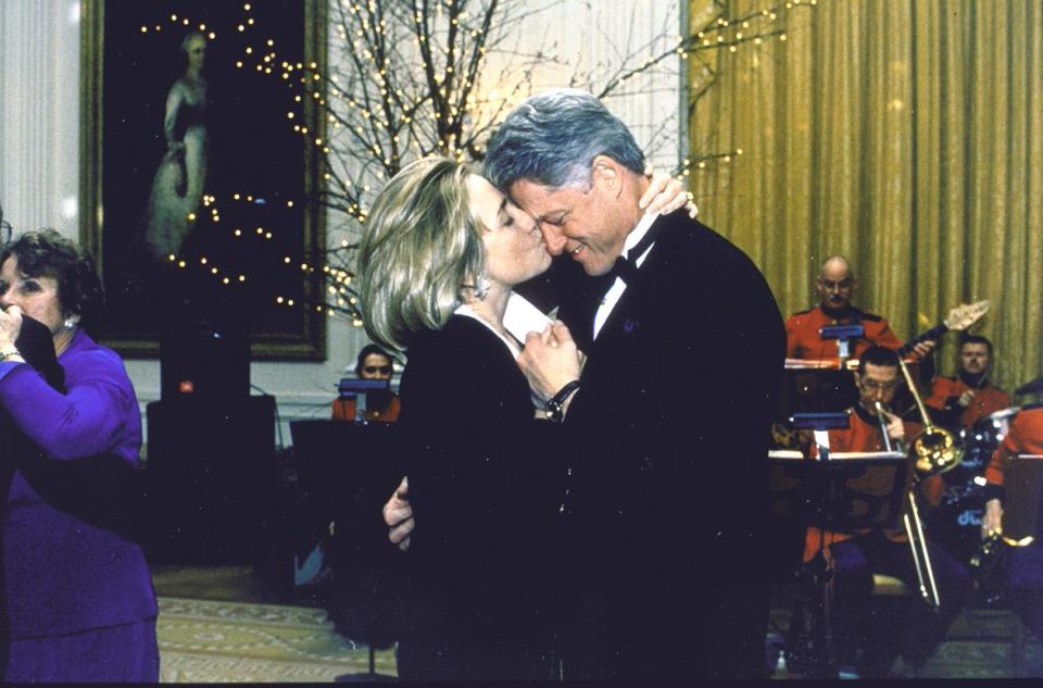 Bill and Hillary Clinton dance during a White House dinner party, 1997.