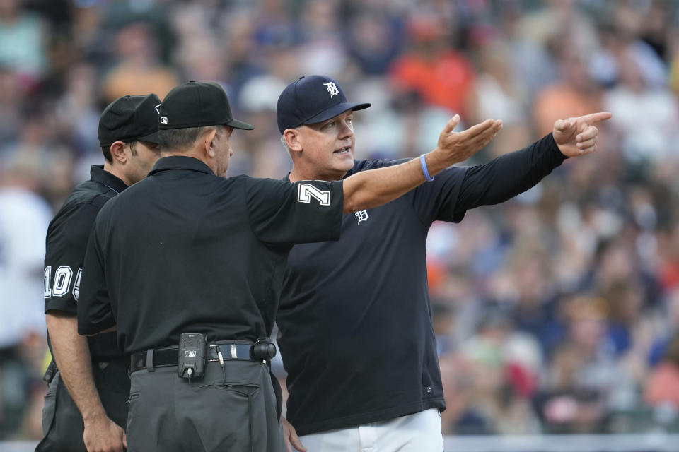 Detroit Tigers manager A.J. Hinch, right, talks with home plate umpire Alex MacKay, left, and Alfonso Marquez against the Minnesota Twins in the fourth inning of a baseball game, Saturday, June 24, 2023, in Detroit. (AP Photo/Paul Sancya)