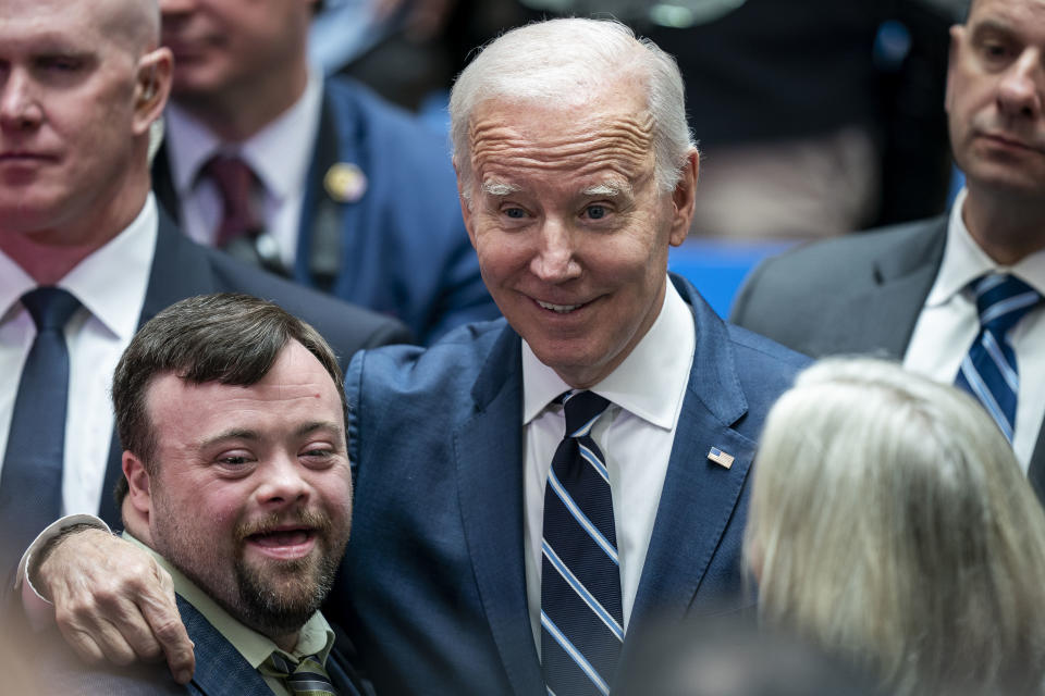 President Joe Biden embraces James Martin, who starred in the recent Oscar winning short film 'An Irish Goodbye', as he visits Ulster University to give a keynote speech in Belfast, Northern Ireland, Wednesday, April 12, 2023. (Aaron Chown/PA via AP)