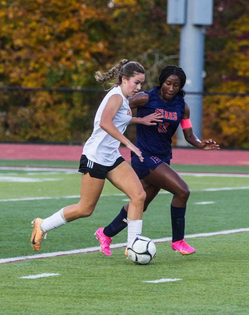 Briarcliff's Sora Marable (blue) and Croton-Harmon's Gwen McManus (white) battle for possession during the Section 1 Class B finals at Nyack High School on Oct. 28, 2023.