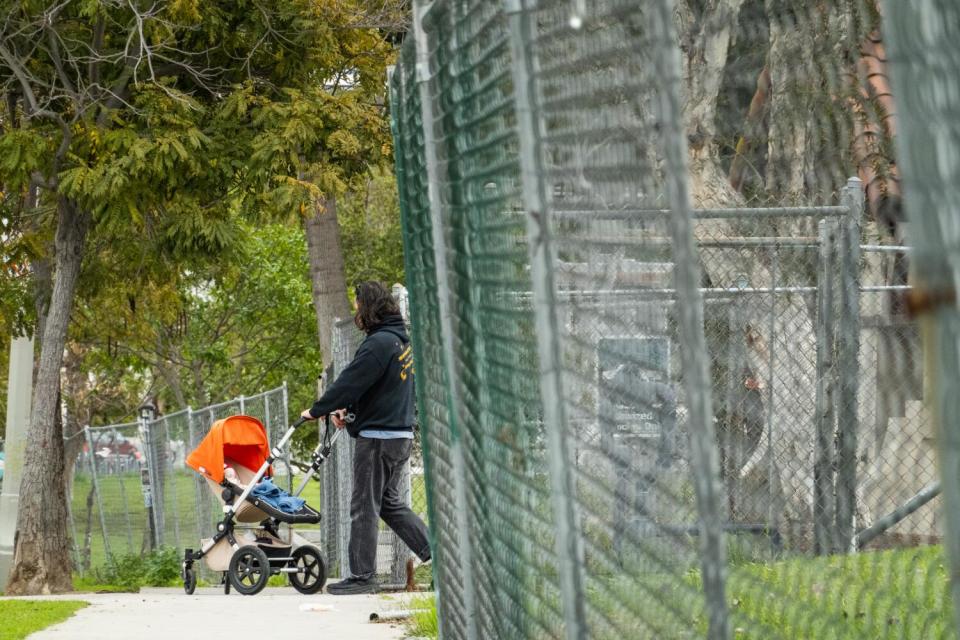 A chain link fence surrounded Echo Park Lake for two years after city workers cleared a massive homeless encampment.