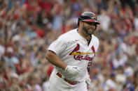 St. Louis Cardinals' Albert Pujols smiles as he rounds the bases after hitting a two-run home run during the eighth inning of a baseball game against the Chicago Cubs Sunday, Sept. 4, 2022, in St. Louis. (AP Photo/Jeff Roberson)