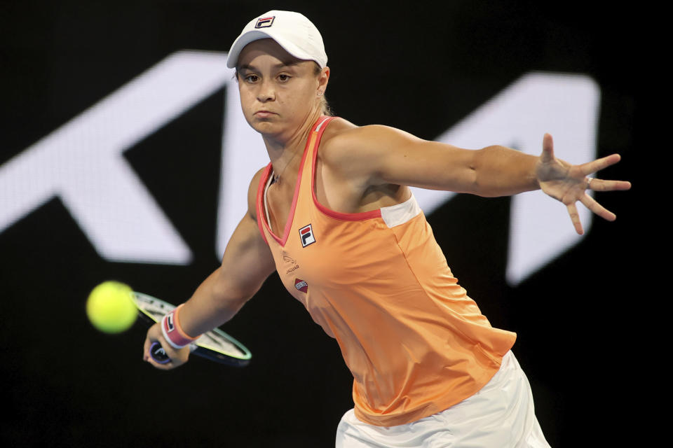 Australia's Ash Barty makes a forehand return to Romania's Simona Halep during an exhibition tennis event in Adelaide, Australia, Friday, Jan 29. 2021. (Kelly Barnes/AAP Image via AP)