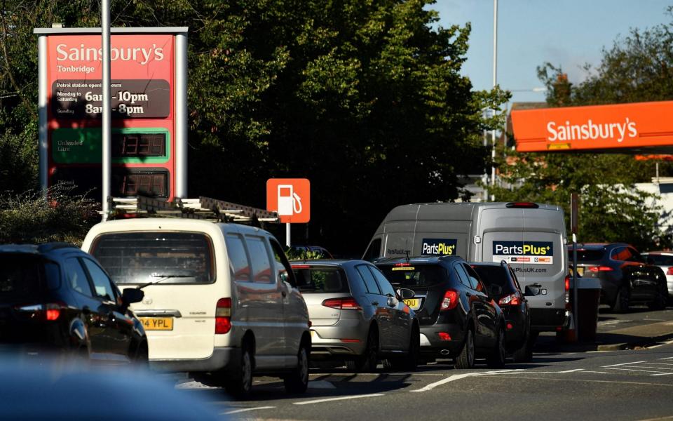Motorists queue for petrol at a Sainsbury's service station in Tonbridge, Kent - BEN STANSALL /AFP