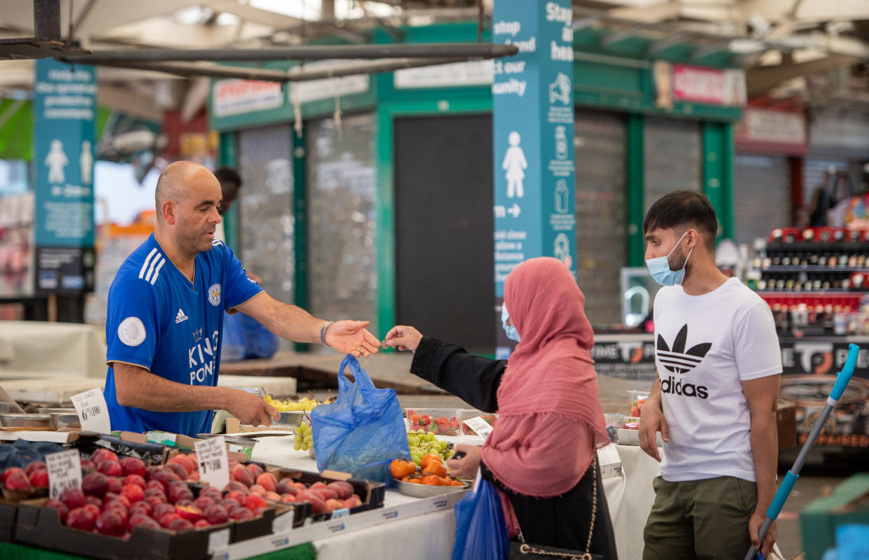 People shop at Leicester Market as a decision is due to be made on whether to lift the lockdown restrictions in the city. (Photo by Joe Giddens/PA Images via Getty Images)