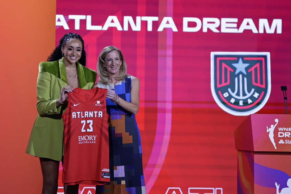 Stanford's Haley Jones, left, poses for a photo with commissioner Cathy Engelbert after being selected by the Atlanta Dream at the 2023 WNBA Draft on April 10, 2023, in New York. (AP Photo/Adam Hunger)