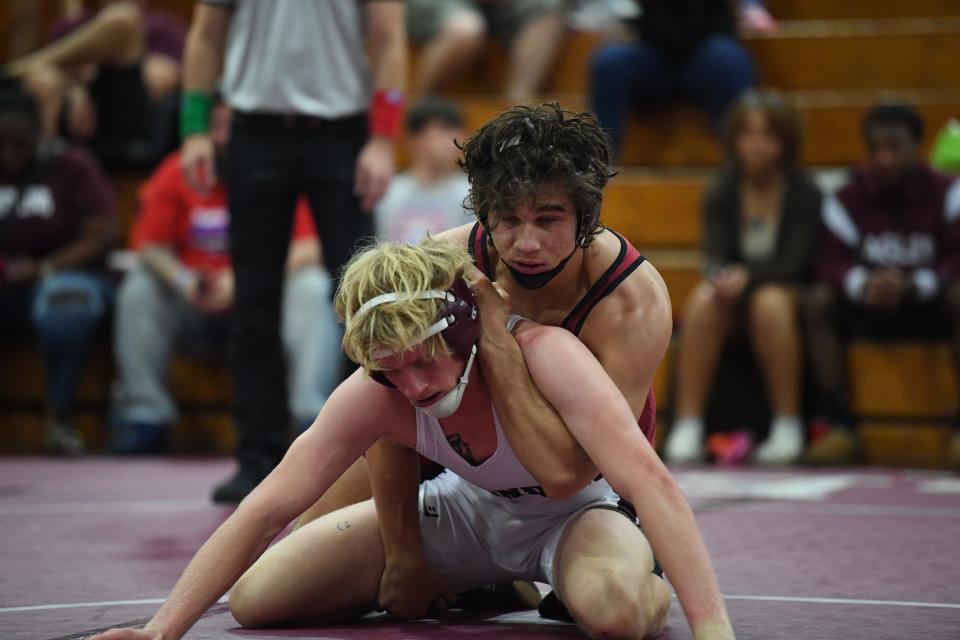 Lake Gibson's Hayden Whidden competes hard in a match vs. Brandon's Tyler Smith. Whidden won a regional championship after a 19-3 technical fall.