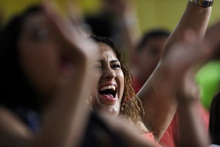 Fans attend a baseball game between Los Artesanos de Las Piedras and Los Halcones de Gurabo during the Puerto Rico Double A baseball league at Las Piedras, Puerto Rico, June 11, 2016. REUTERS/Alvin Baez