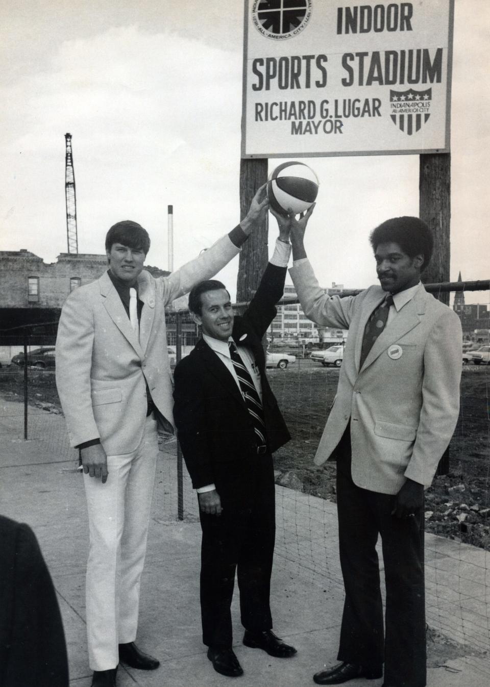 Indiana Pacers players Bob Netolicky, left, and Roger Brown, right, and Indianapolis Mayor Richard Lugar, center, pose in 1971 at the construction site of Market Square Arena in downtown Indianapolis. (Indianapolis Star file photo)