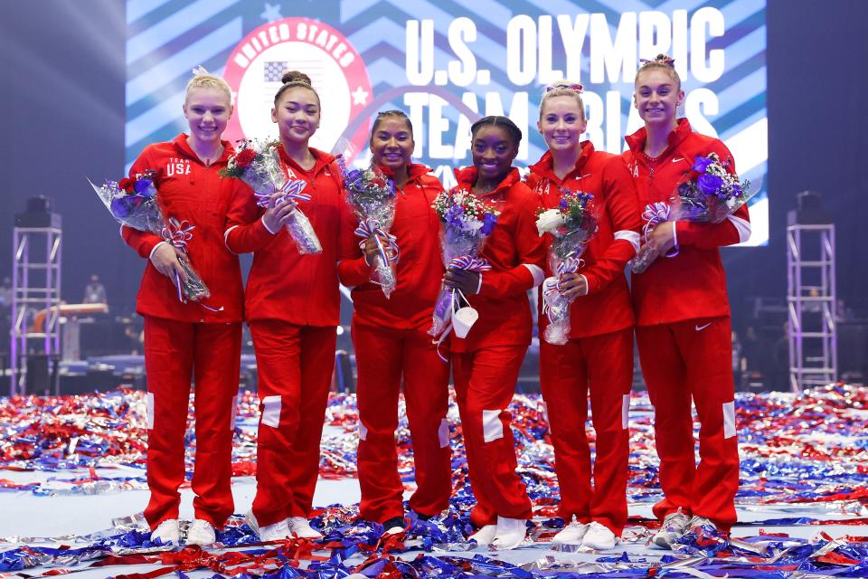 (L-R) Jade Carey, Sunisa Lee, Jordan Chiles, Simone Biles, Mykayla Skinner and Grace McCallum, the women that will represent Team USA, pose following the Women's competition of the 2021 U.S. Gymnastics Olympic Trials.