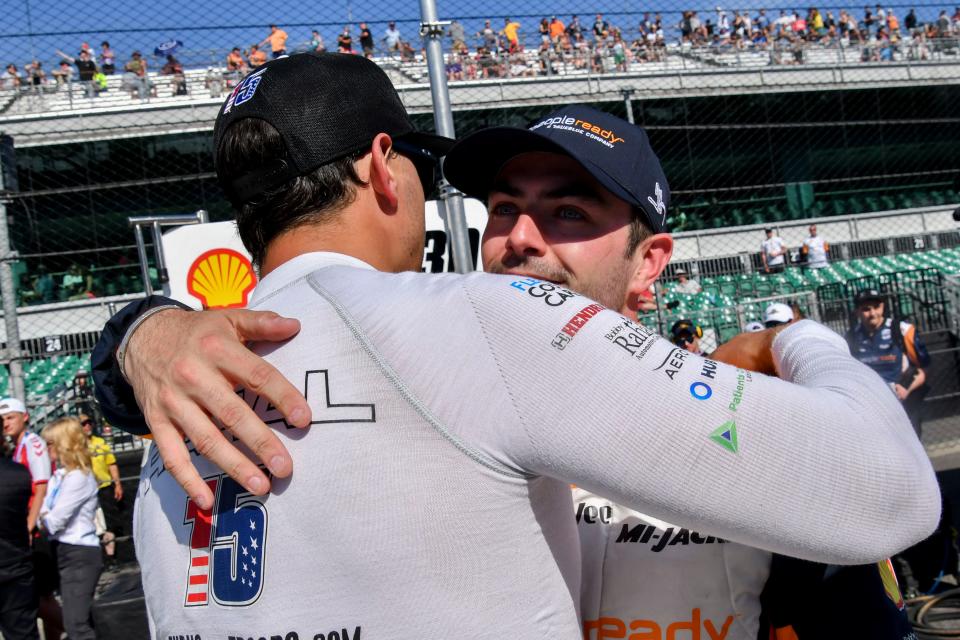 Rahal Letterman Lanigan Racing driver Graham Rahal (15) hugs Rahal Letterman Lanigan Racing driver Jack Harvey (30) on Sunday, May 21, 2023, during the second day of qualifying ahead of the 107th running of the Indianapolis 500 at Indianapolis Motor Speedway. 