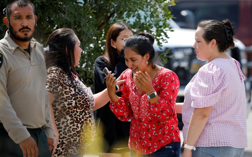 Parents and families wait for news outside the Ssgt Willie de Leon Civic Center in Uvalde - REUTERS