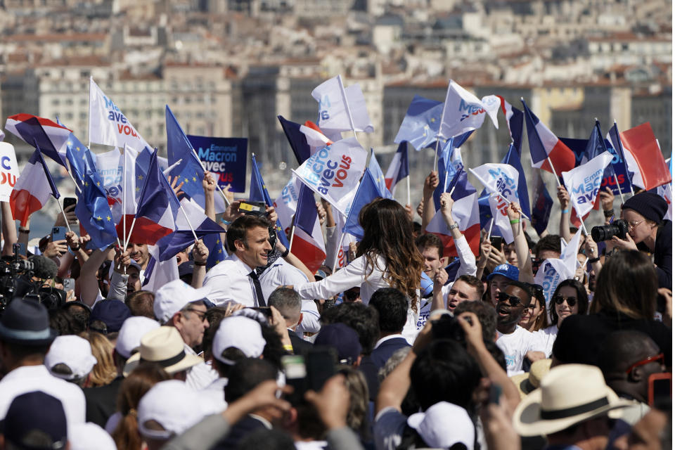 French President and centrist candidate Emmanuel Macron arrives at a campaign rally, Saturday, April 16, 2022 in Marseille, southern France. Far-right leader Marine Le Pen is trying to unseat centrist President Emmanuel Macron, who has a slim lead in polls ahead of France's April 24 presidential runoff election. (AP Photo/Laurent Cipriani)