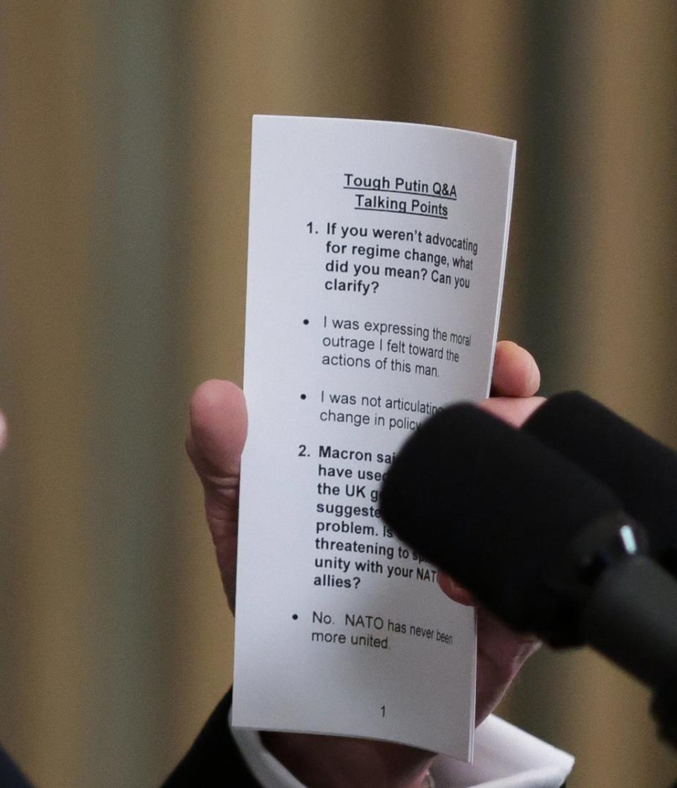 The printed paper held by Biden shows talking points related to his comments on Vladimir Putin and Nato (EPA)